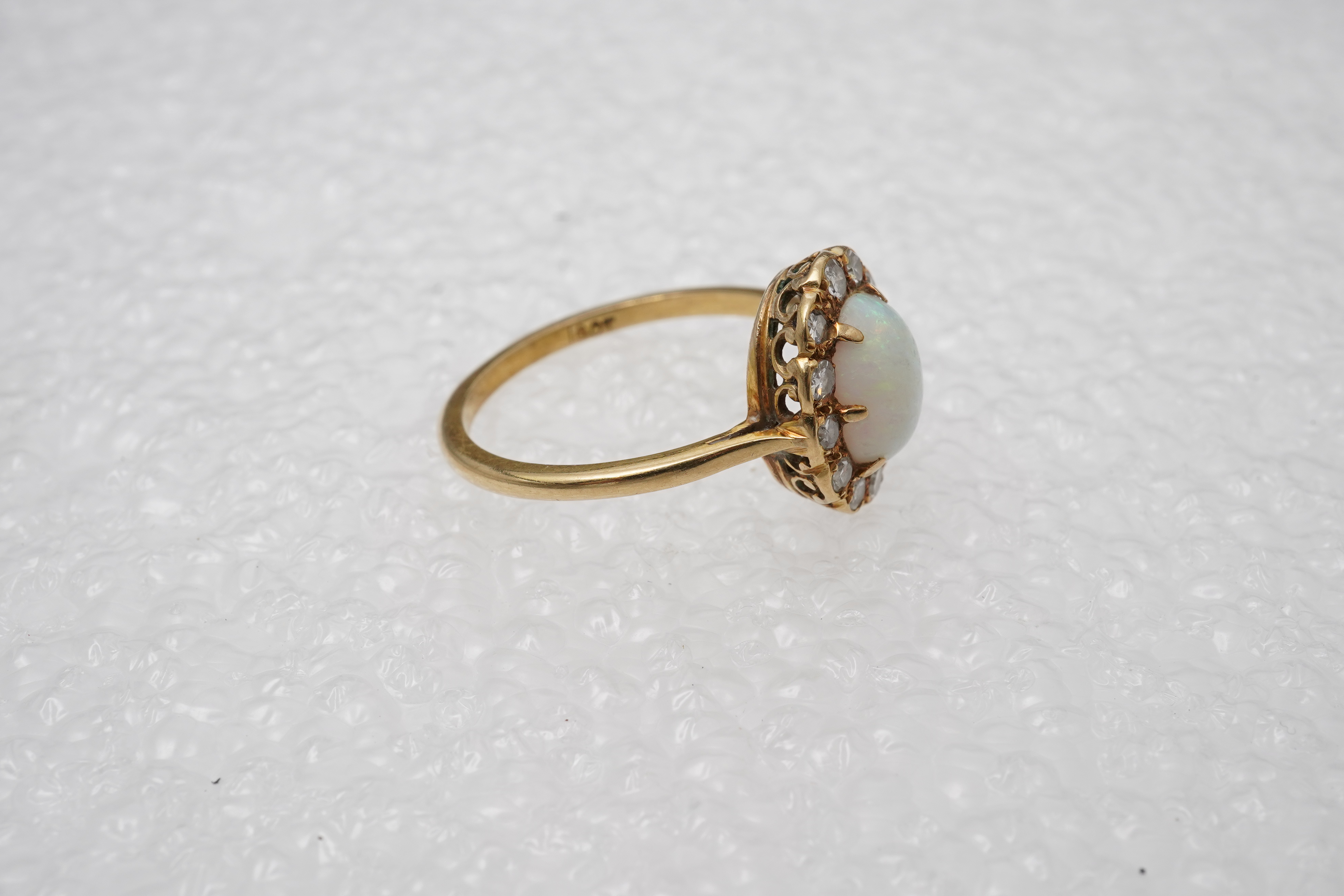 An opal and diamond cluster ring, mid 20th century